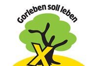 Stilisierter Baum mit gelbem X und Schriftzug "Gorleben soll leben"